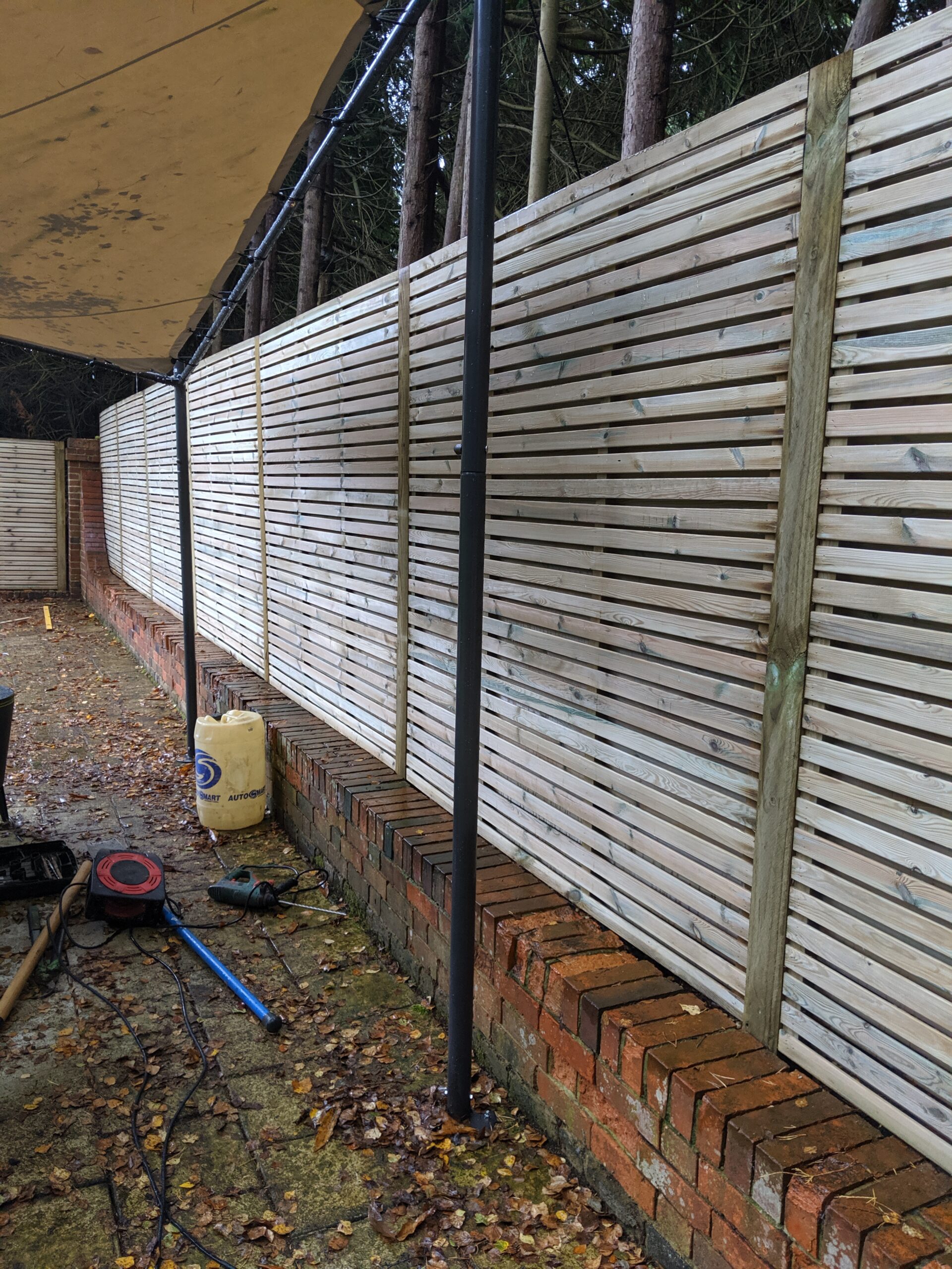 A run of decorative contemporary panels with timber posts