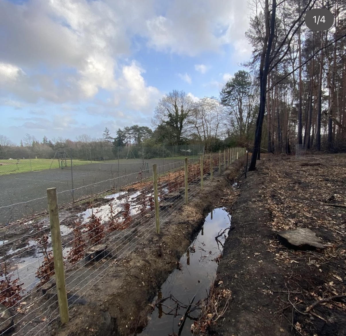 Stock wire fencing with round timber posts